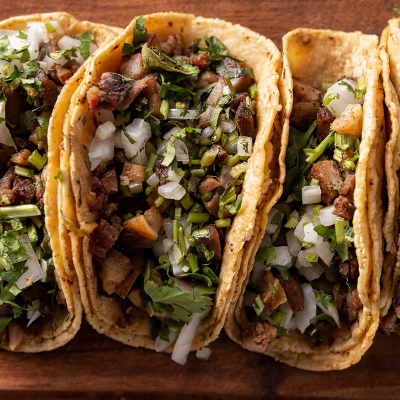 carne asada tacos on corn tortillas